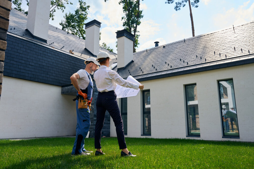 two gentlemen performing a proper home inspection
Alt description: two gentleman professionals performing an exterior home inspection on a house